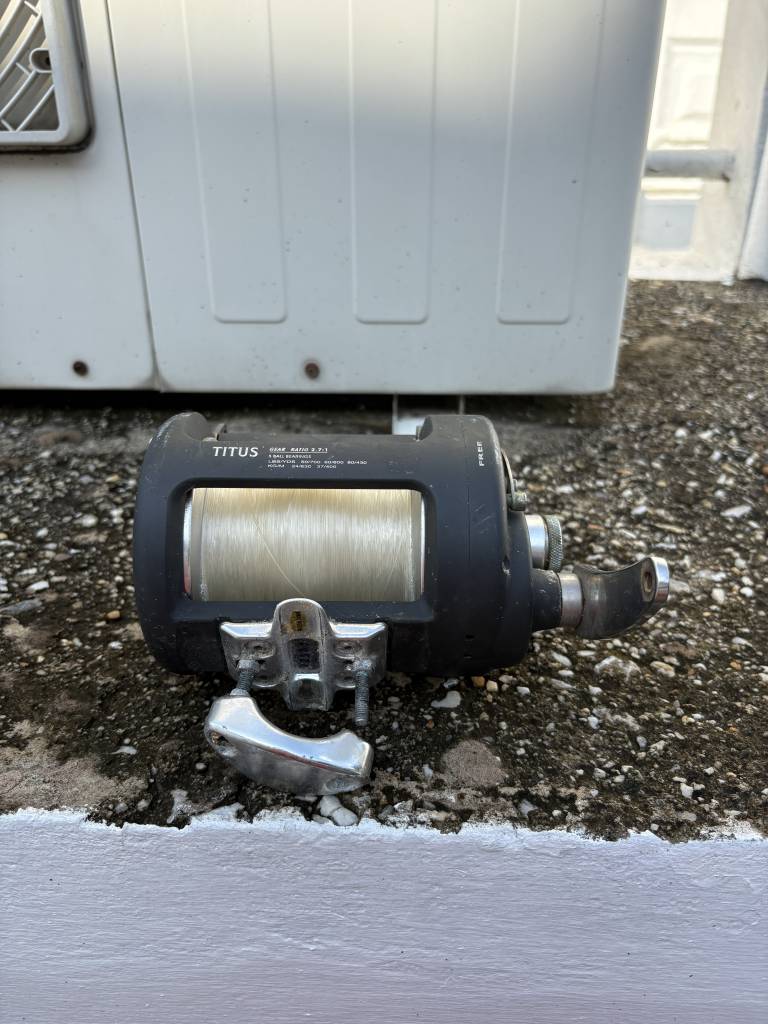 Titus Conventional Fishing Reel with Line and Clamp